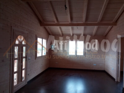 Interior de Casa Escanio con paredes de madera natural